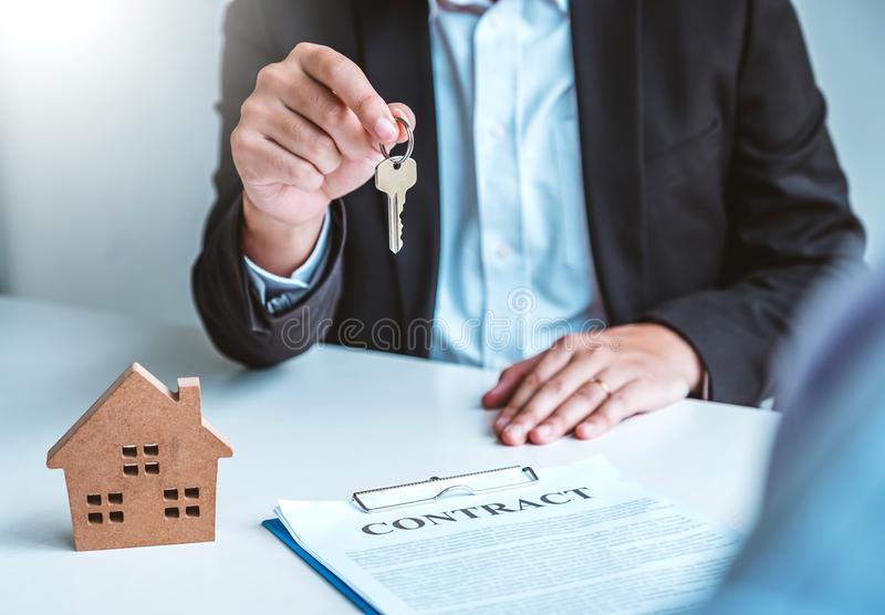 sale-agent-giving-house-keys-to-woman-customer-sign-agreement-documents-realty-purchase-sale-agent-giving-house-keys-to-159311484